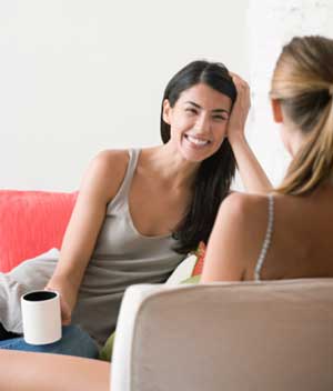 Women Talking and Drinking Coffee